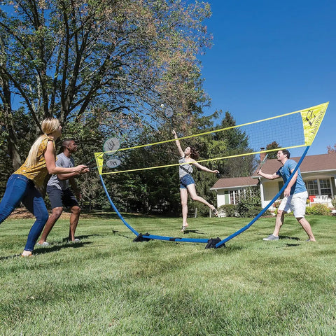 Backyard Badminton Set With Easy Setup Net 4 Steel Shaft Rackets 2 Durable Shuttlecocks in use during outdoor family fun