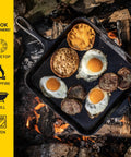 Seasoned Cast Iron Square Griddle Pan, 11 Inch Durable Cookware with eggs and sausage cooking over campfire