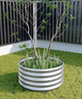 Two Pack Galvanized Round Raised Garden Bed Kit 2x2x1 Feet For Veggies Herbs Flowers Outdoor Planter Box Easy Assembly Rust Resistant Durable Steel Silver with plants and small tree on grass
