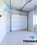 16 Inch Oscillating Wall Mount Fan With Remote Control 3 Speed 2050 CFM in a garage with white walls