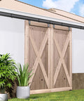 12 Foot Ceiling Mount Double Sliding Barn Door Hardware Kit For Exterior Use Beefy Box Track System Supports Up To 300 Pounds Fits Two 36 Inch Doors Hardware Only No Door Included Easy Install And Durable Steel Finish installed on double wooden doors with plants in front, exterior view.