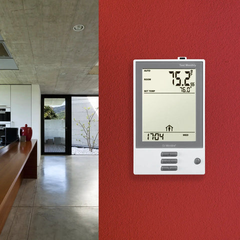 Programmable Thermostat With Floor Sensor And Class A GFCI, White Finish, NHance UDG-4999 Model, mounted on red wall in home.