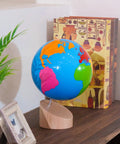 Montessori Color Globe 8.7 Inch Beechwood World Globe With Continent Outlines for Kid-Friendly Geography Learning on a shelf