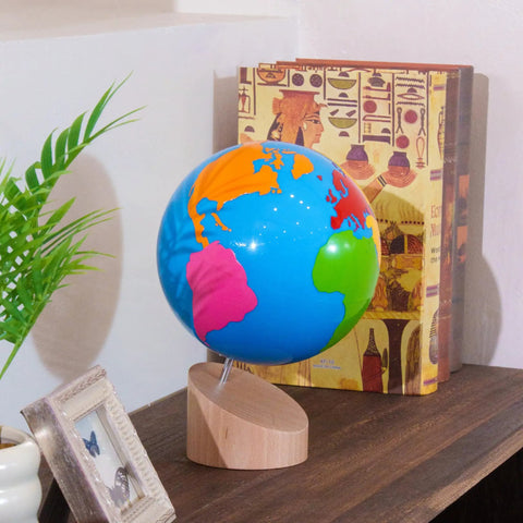 Montessori Color Globe 8.7 Inch Beechwood World Globe With Continent Outlines for Kid-Friendly Geography Learning on a shelf