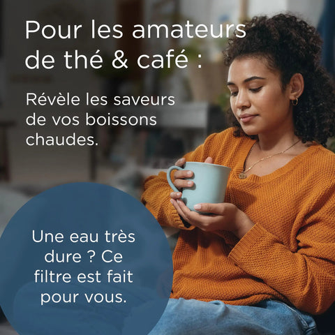 A woman holding a coffee cup wearing an orange sweater, showcasing the importance of 12 Pack Replacement Water Filter Cartridges For Coffee Machines And Kettles Kick Limescale To The Curb Strip Chlorine For Crisp Better Tasting Brews Anytime Smooth Installation Top Shelf Appliance Defense.