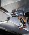 Compact 18V Cordless Drill Driver With Brushless Motor And Rugged Locking Chuck Supporting 5In1 Flexiclick Quick Swap System Paired With A Badass 4Ah Battery Pack being used to secure metal ductwork.
