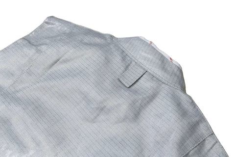 Back view of Pro Grade Lame Fencing Vest For Foil And Saber Practice And Competition, close-up of metallic fabric texture.