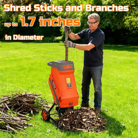 Person using 15 Amp Electric Wood Chipper Shredder With Collection Bag And Push Stick, Double Sided Blade System, Auto Shut Off, 1.7 Inch Cutting Capacity For Leaves Grass Clippings, Easy Roll On Wheels For Yard Cleanup on lawn