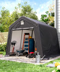 Tough As Nails 10 By 10 Outdoor Portable Storage Shed With Heavy Duty Steel Frame And Roll Up Door Garage Shelter in a garden.