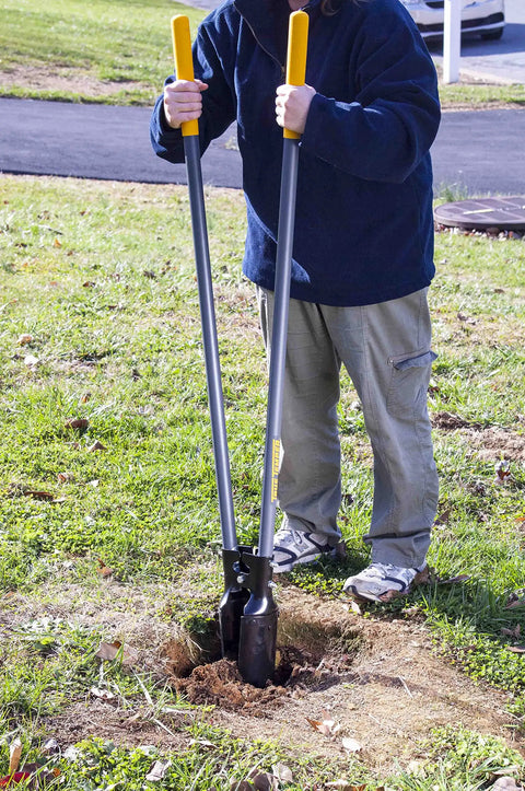 Person using Post Hole Digger With 48 Inch Fiberglass Handle, Atlas Pattern Steel Point For Easy Holes in a grassy garden area.