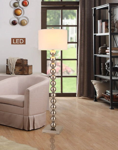 Cosimo 61 Inch Brushed Nickel LED Floor Lamp With Dimmer featuring steel ball design in a living room setting