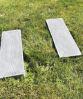 Wooden Board Molds For Concrete Stepping Stones And Garden Walkways, DIY Paver Molds For Patios And Paths, Reusable Plastic Molds Set Of 2 For Easy Stone Crafting At Home on grass.