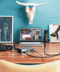 Volt 2 USB Audio Interface with Vintage Preamp Mode and 24-Bit 192 KHz Conversion on desk with speakers and laptop