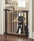 Rock Solid Wooden Dog Gate With Walk Through Swing For Indoor Puppy Protection And Pressure Mount Setup securing a doorway with a black dog.