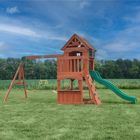 Atlantis Cedar Wood Swing Set With Wave Slide And Raised Clubhouse Featuring Rock Wall, Belt Swings, Sandbox Area in Backyard
