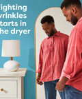 Man admiring wrinkle-free shirt in mirror beside text about Unscented Dryer Sheets 240 Count For Sensitive Skin Hypoallergenic Dermatologist Tested.