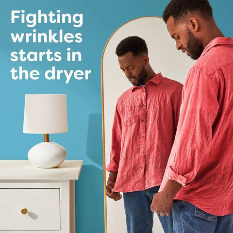 Man admiring wrinkle-free shirt in mirror beside text about Unscented Dryer Sheets 240 Count For Sensitive Skin Hypoallergenic Dermatologist Tested.