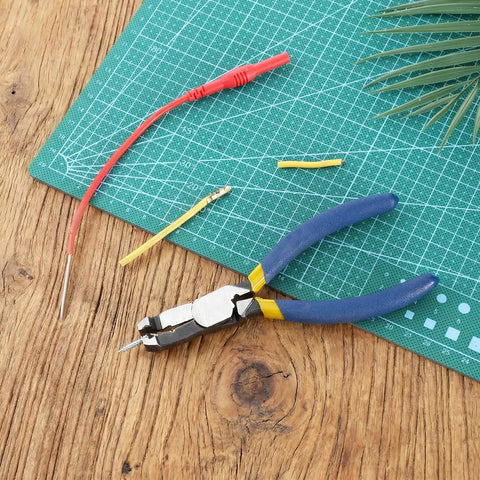 Multi Function Screw Cutter Pliers With Non Slip Serrated Jaws on cutting mat with electrical wires, chrome vanadium steel