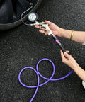 Beefy Hybrid Air Compressor Hose 1/4 Inch By 10 Foot, 300 PSI Heavy Duty All Weather Flex with aluminum couplers in use.