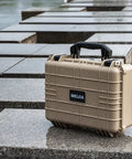 All Weather Waterproof Hard Case With Customizable Foam Insert For Drones, Cameras And Gear, Fits Pistols, IP67 Sealed, Rugged Desert Tan Travel Case 15.98 x 12.99 x 6.85 Inches on wet stone surface