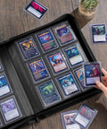 Person adding card to Top Loader Binder For Trading Cards And Sports Cards, Holds 324 Toploaders, 9 Pocket Pages, Waterproof PU Leather