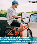 Man wearing Gnarly Protective Padded Shorts For Snowboard, Skate And Skiing with BMX bike at skatepark.