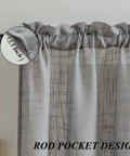 Close-up of a gray linen textured swag curtain valance with rod pocket showing 2.5-inch header.