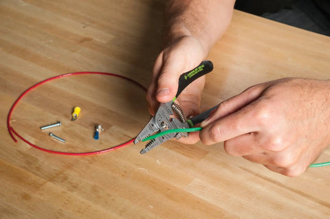 Person using Stainless Steel Wire Stripper For 10-18 AWG Solid And 12-20 AWG Stranded, Heavy Duty Stripper Cutter And Crimper Tool