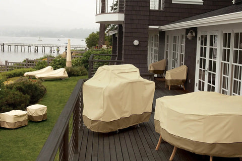 Veranda 94 Inch Round Patio Table And Chair Cover With Umbrella Hole, water resistant, shown on a deck fitting tables and chairs