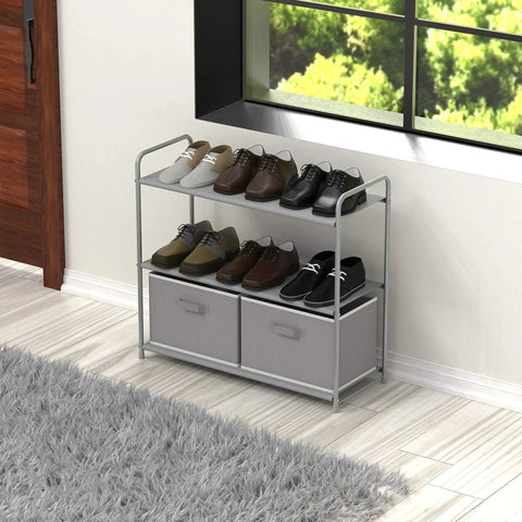 3 Tier Closet Organizer With 2 Drawers, Grey Fabric Shelves, And Metal Frame, holding shoes near a window on light flooring.