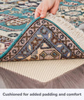 Hand lifting rug to show Super Grip Natural Non Slip Rug Pad Cushioned 2 By 3 Feet For Area Rugs And Runner Rugs On Hardwood Floors