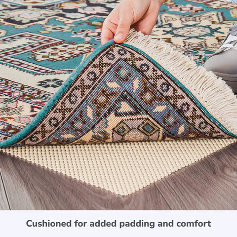 Hand lifting rug to show Super Grip Natural Non Slip Rug Pad Cushioned 2 By 3 Feet For Area Rugs And Runner Rugs On Hardwood Floors