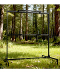 Heavy Duty Archery Target Stand for Bag Targets Foam Blocks Cubes and Paper Targets in a forest setting.