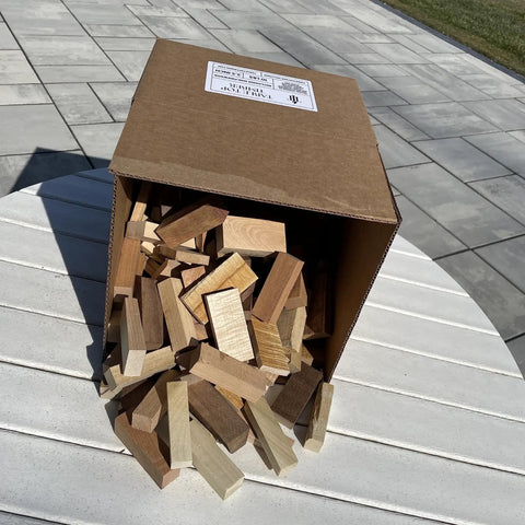 Mini Fire Wood And Fire Starters From Reclaimed Kiln Dried Hardwood, Five Or Ten Pound Packs, scattered on a table