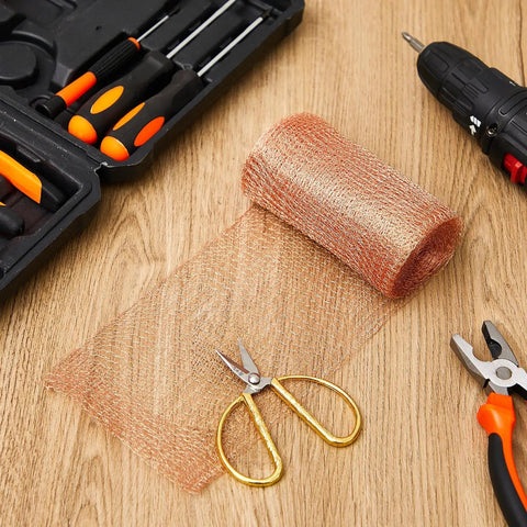 Two Rolls Of 8 By 32 Ft Copper Mesh For Rodent And Pest Control with tools on wooden surface