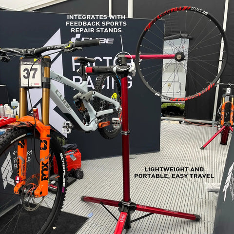 Pro Truing Stand With Thru Axle Adapter Compact Portable Aluminum Single Arm Design for Repair Stand, supporting bike wheel.