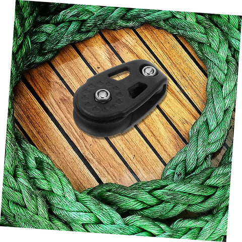 Kayak Anchor Trolley Kit With Nylon Single Sheave Blocks for smooth anchor adjustments on green rope and wood surface.