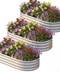 Oval Galvanized Raised Garden Bed Set 3 Pack 6x3x1ft Metal Garden Beds Planter Boxes Outdoor Durable Raised Beds for Vegetables and Flowers Easy Access From All Sides Silver with colorful flowers