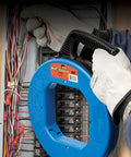 Electrician using VoltGuard Fish Tape For Electricians 120 Ft Pulling Tape With Non Conductive Eyelet And Fiberglass Core Pro Grade