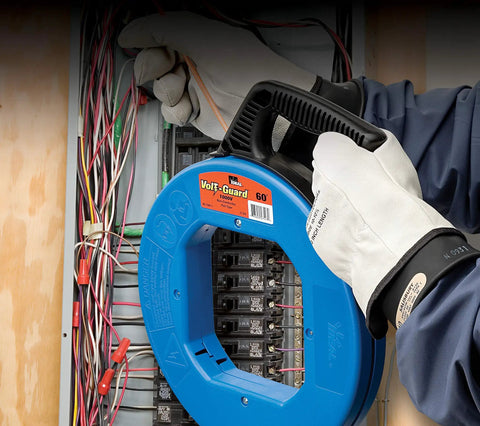 Electrician using VoltGuard Fish Tape For Electricians 120 Ft Pulling Tape With Non Conductive Eyelet And Fiberglass Core Pro Grade