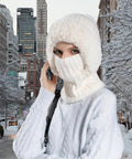 Person wearing Cozy Fleece Lined Double Layer Balaclava Beanie Set With Pompom Winter Ski Snow Hat And Circle Scarf in snowy city