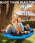 Two kids on a 40 Inch Saucer Tree Swing With 900Lb Weight Capacity Waterproof Seat For Kids Outdoor Play and Hanging Straps
