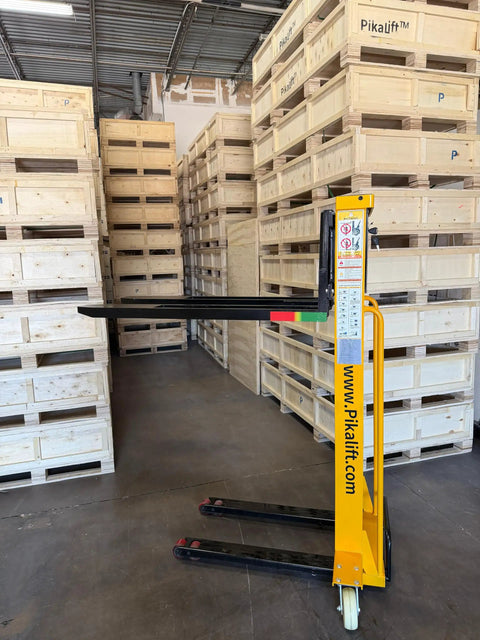 Self Loading Electric Pallet Stacker With 2116 Lbs Capacity And 51 Inch Lift Height in warehouse next to wooden pallets.