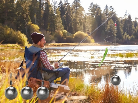 Forty Piece Round Fishing Weights Set Ball Sinkers With Barrel Swivels For Saltwater And Freshwater Casting Drop Shot Catfishing Three Eighth Ounce Ten Gram Lead Weights Built Tough For Real World Fishing on a fishing line by a lakeshore