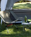 Ultralight Camping Chair For Backpacking With Anti Sink Feet Ultra Portable Folding Hiking Stool outside tent on grass with table