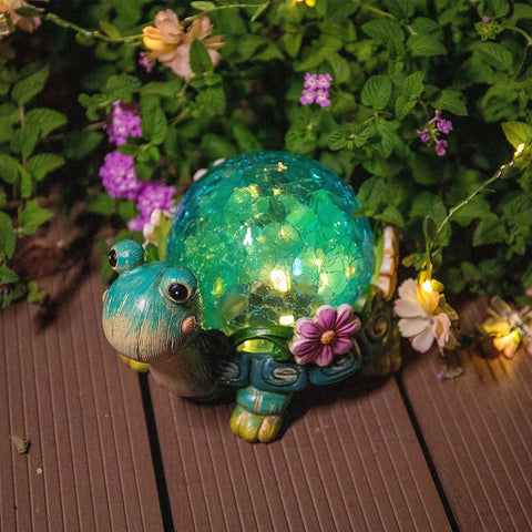 Garden Turtle Statue Outdoor Decor Resin Figurine with glass solar lights glowing on patio with UV protection and LED lights