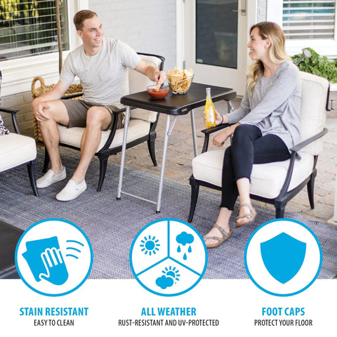 Stacking Compact Folding Table 30 By 20 Inches For Indoor And Outdoor Use Portable Black And Silver Folding Table with two people seated.