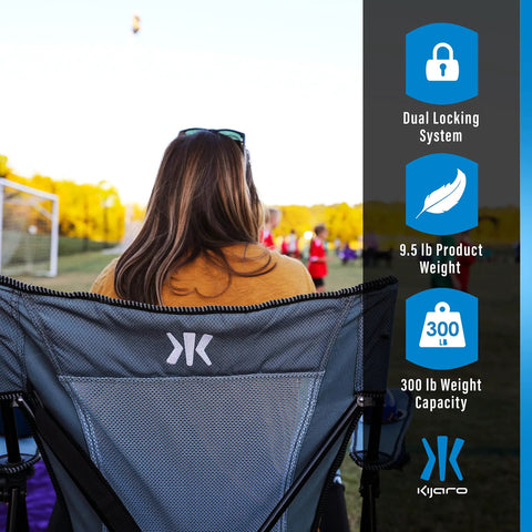 Back view of woman sitting in Versatile Folding Outdoor Chair For Camping And Lawn With Dual Lock System in Hallet Peak Gray.
