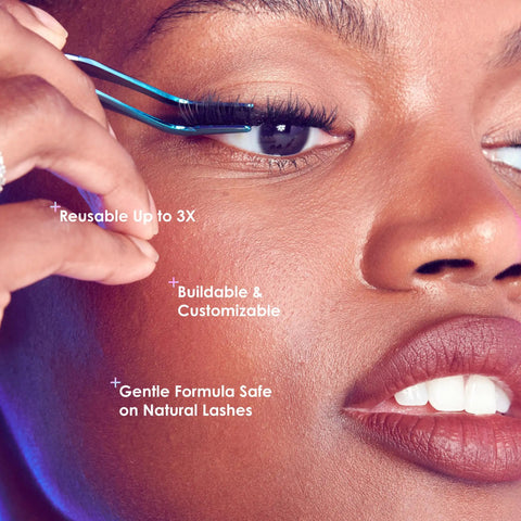 Close-up of person applying Complete DIY Eyelash Extensions Starter Kit With Bond And Seal, using precision applicator.
