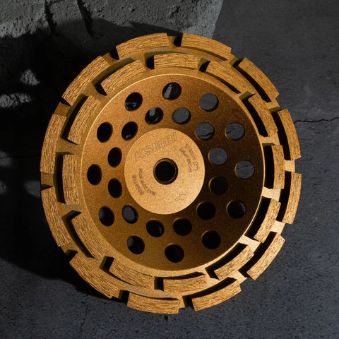Top Tier Double Row Segmented Diamond Concrete Grinding Wheel For 4 1/2 Inch Angle Grinders 5/8-11 Arbor, golden surface, circular design.